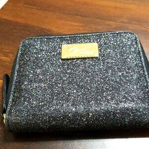 Love Betsey by Betsey Johnson wallet small with a lot of slots .Sparkling fabric
